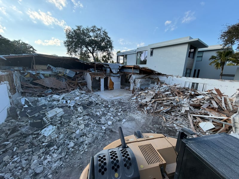Excavator demolishing a single-story home in Fort Lauderdale, 2026