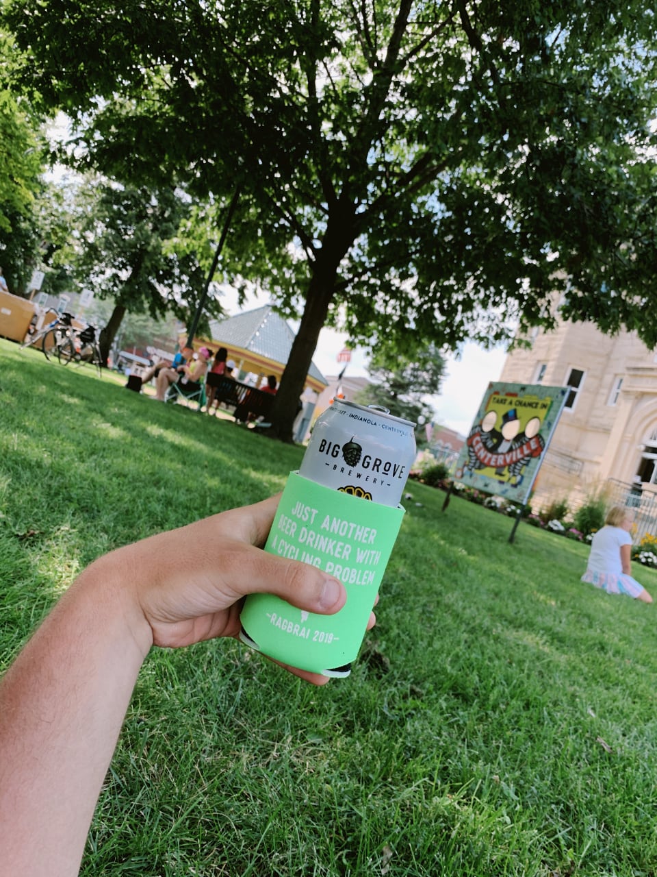 Me holding a Tailwind beer at our resting town for the night, Centerville