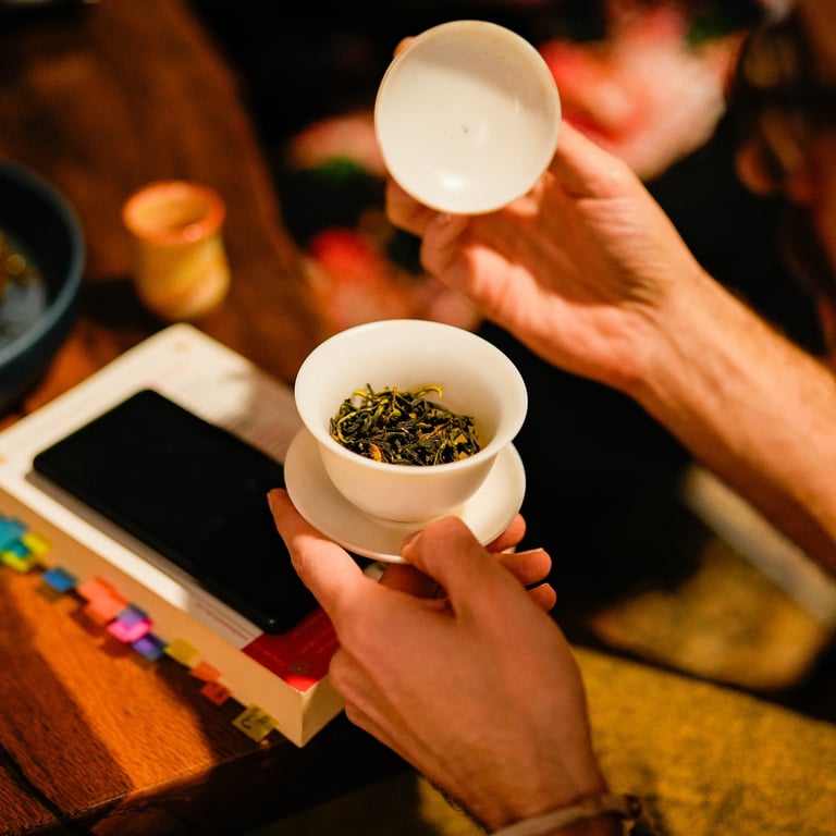 Teacher preparing tea in porcelain cup