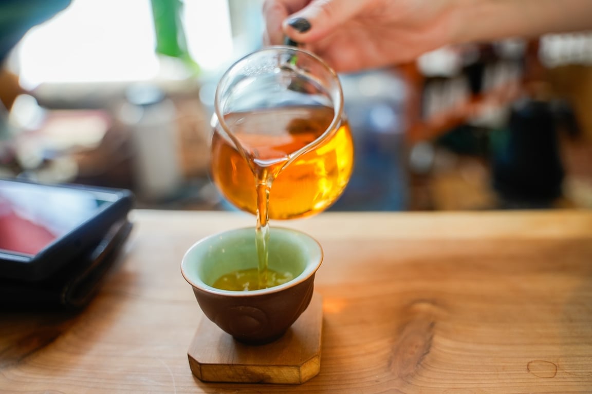 Amber tea being poured