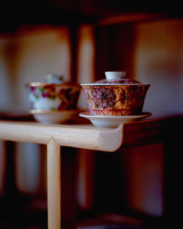Ornate porcelain tea bowls with lids