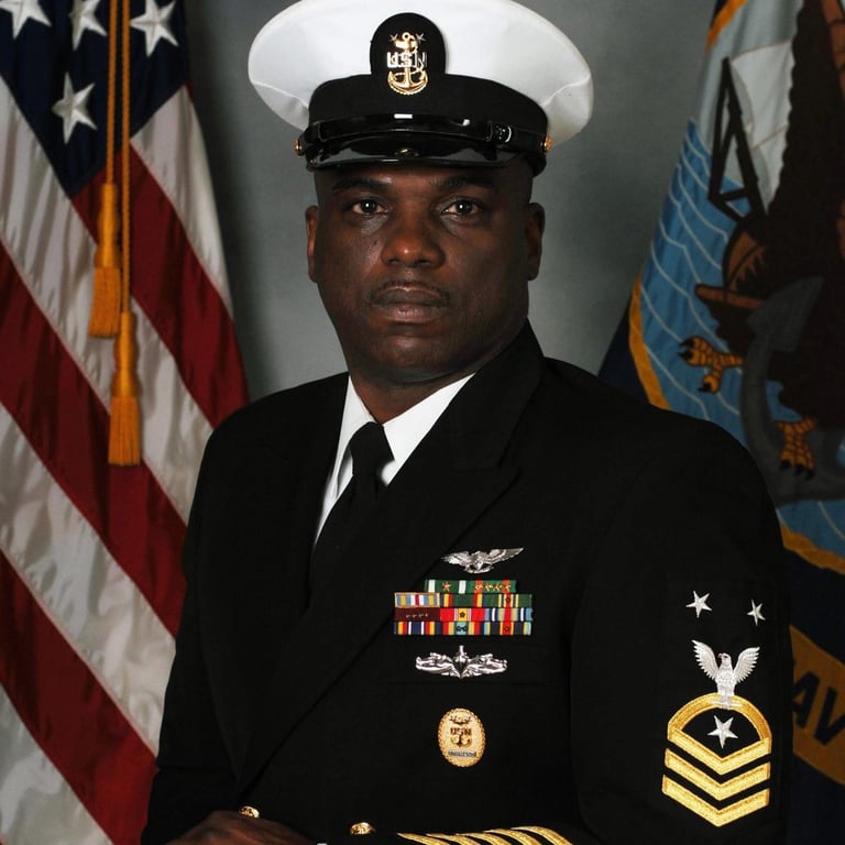 Dr. Wayne Marcus in Navy Command Master Chief uniform displaying 30 years of military leadership
