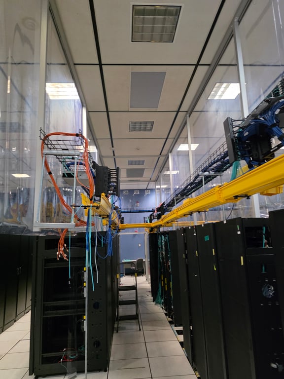 Data center hallway with overhead cable management