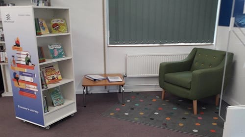 Tye Green Library's Literacy Area Bookshelves and a Chair