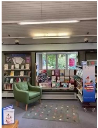 Great Baddow Library Literacy area shelves with a green chair