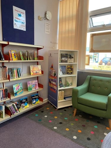 Burnham-on-Crouch Library's Literacy Area chair with bookshelves