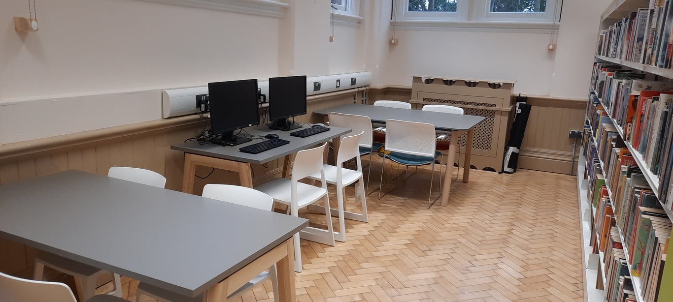 Interior photo of study spaces and computer access