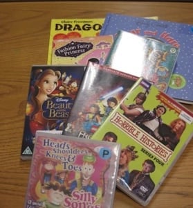 children's DVDs and books scattered on a table