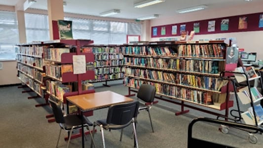 shelves with books and desks