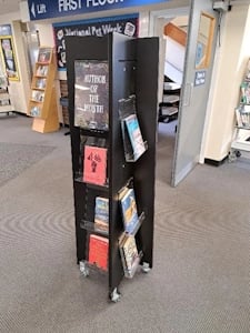 Black display stand with books