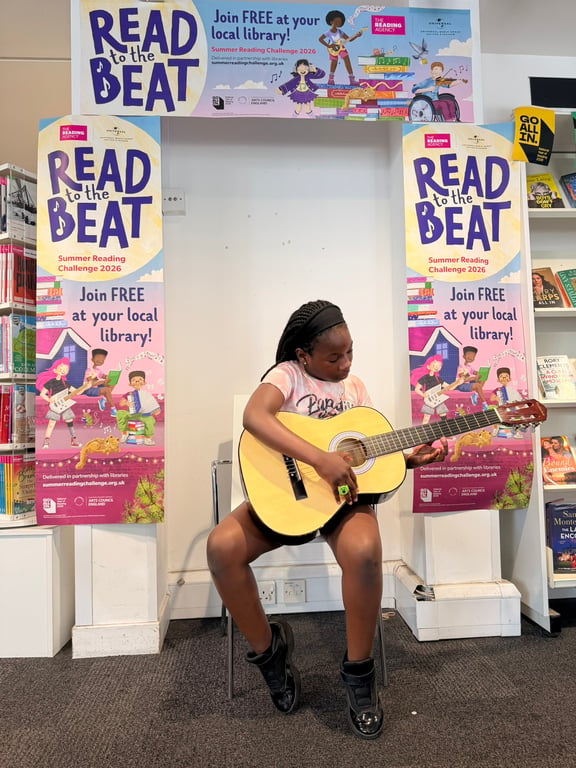 Girl with Guitar promoting library activities