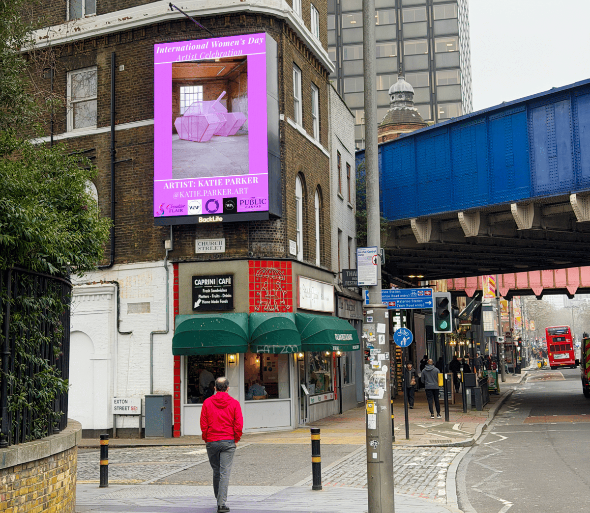 Artist work on a London billboard