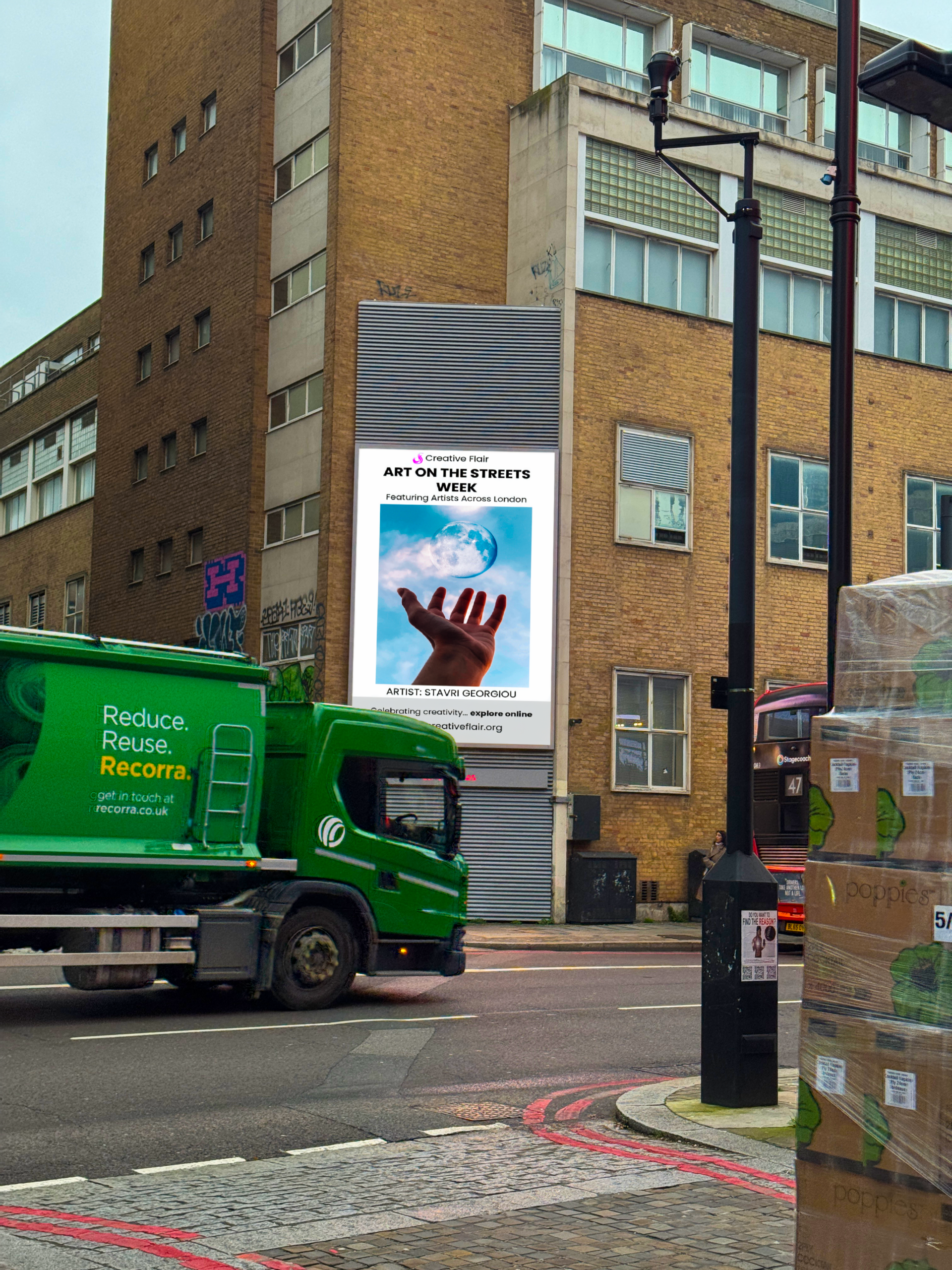 Artist work on a London billboard