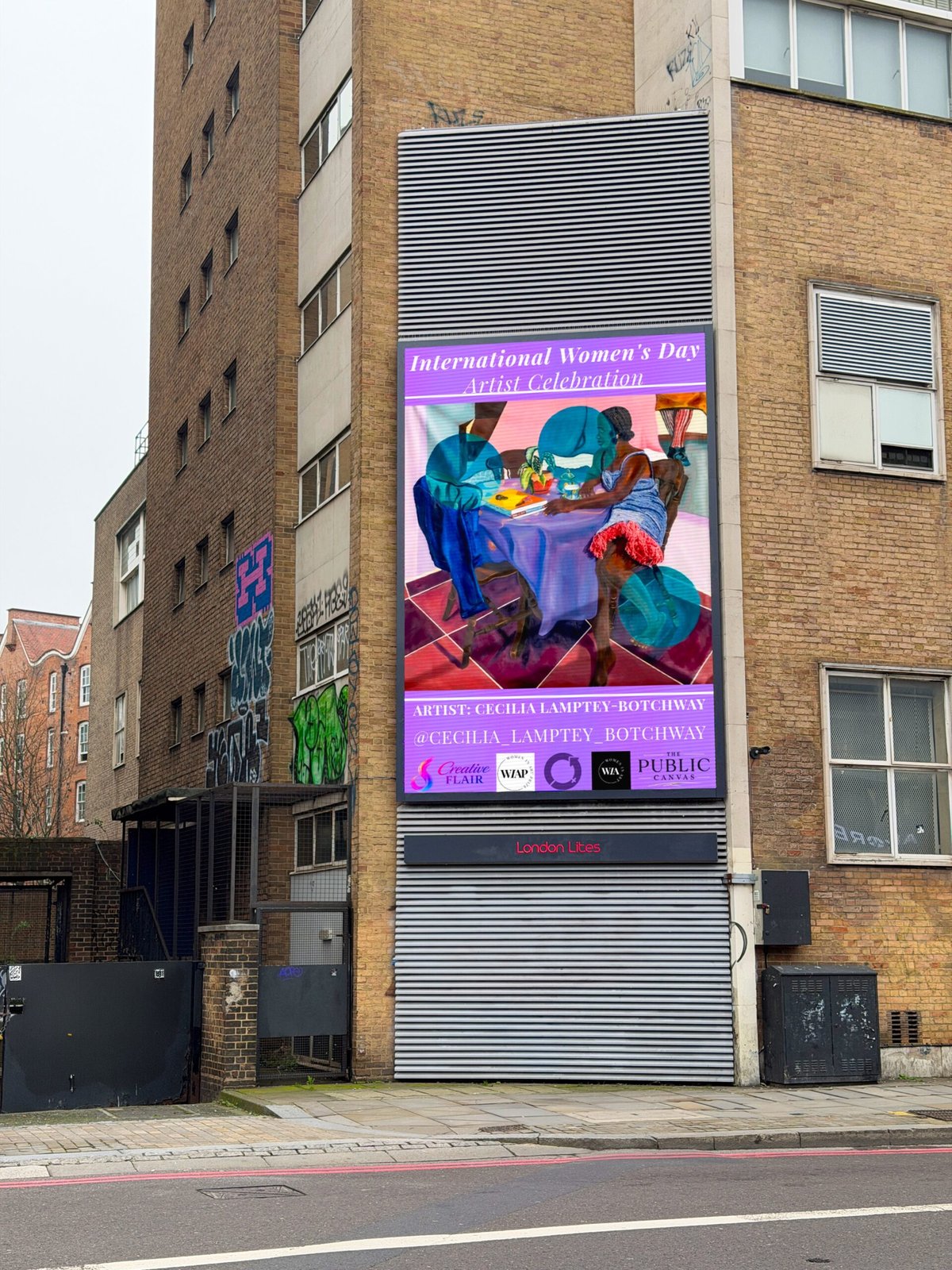 Artist work on a London billboard