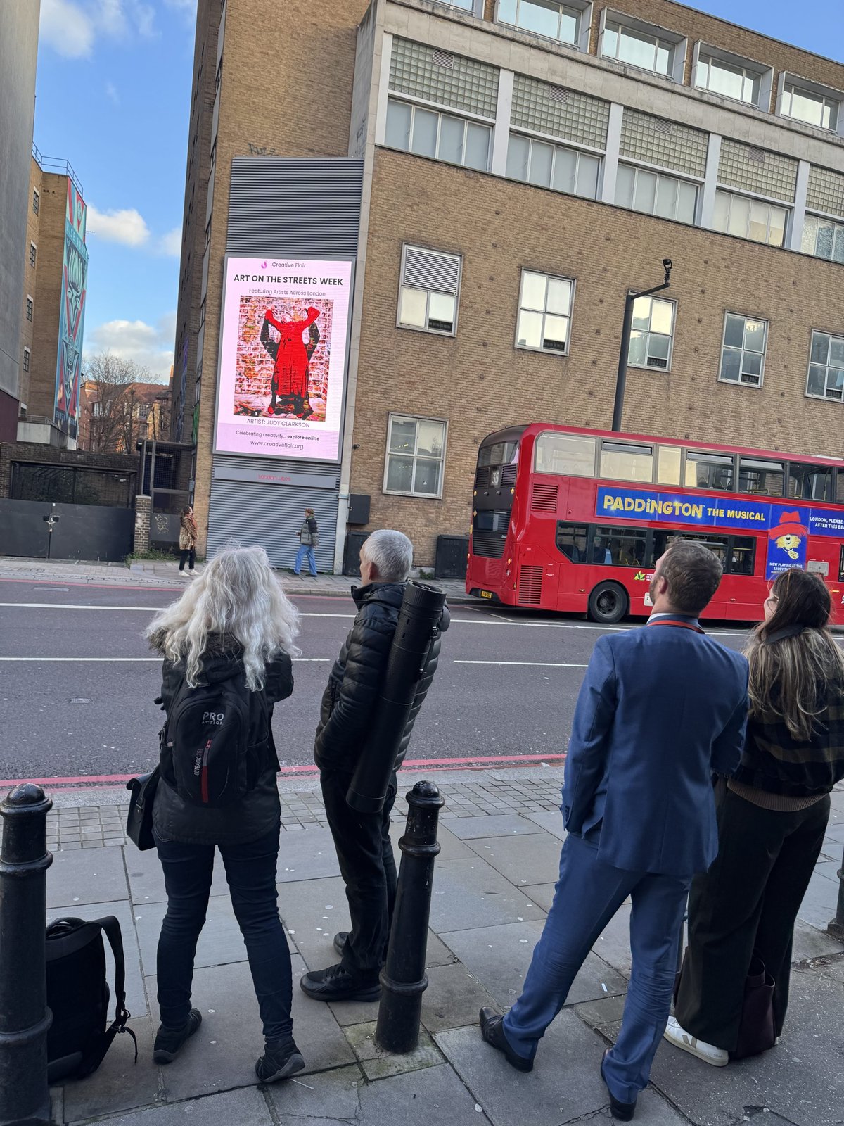 Artist work on a London billboard