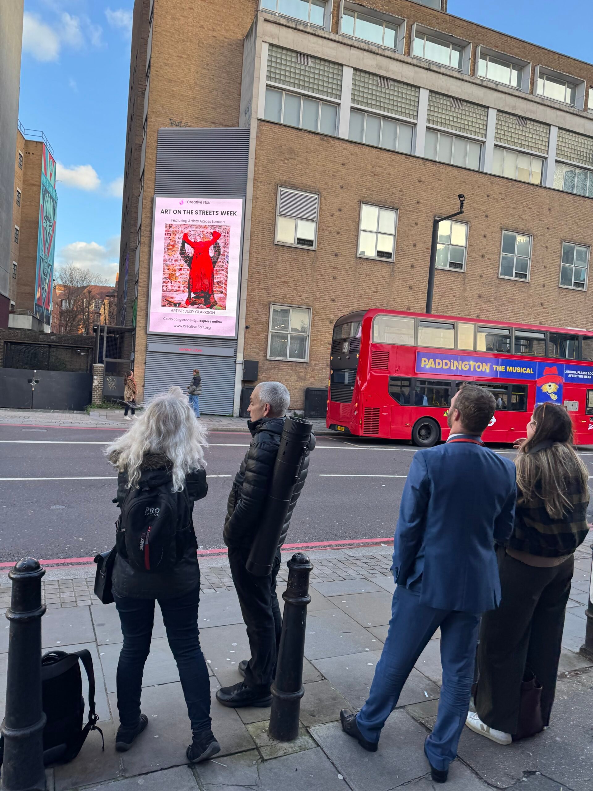 Artist work on a London billboard