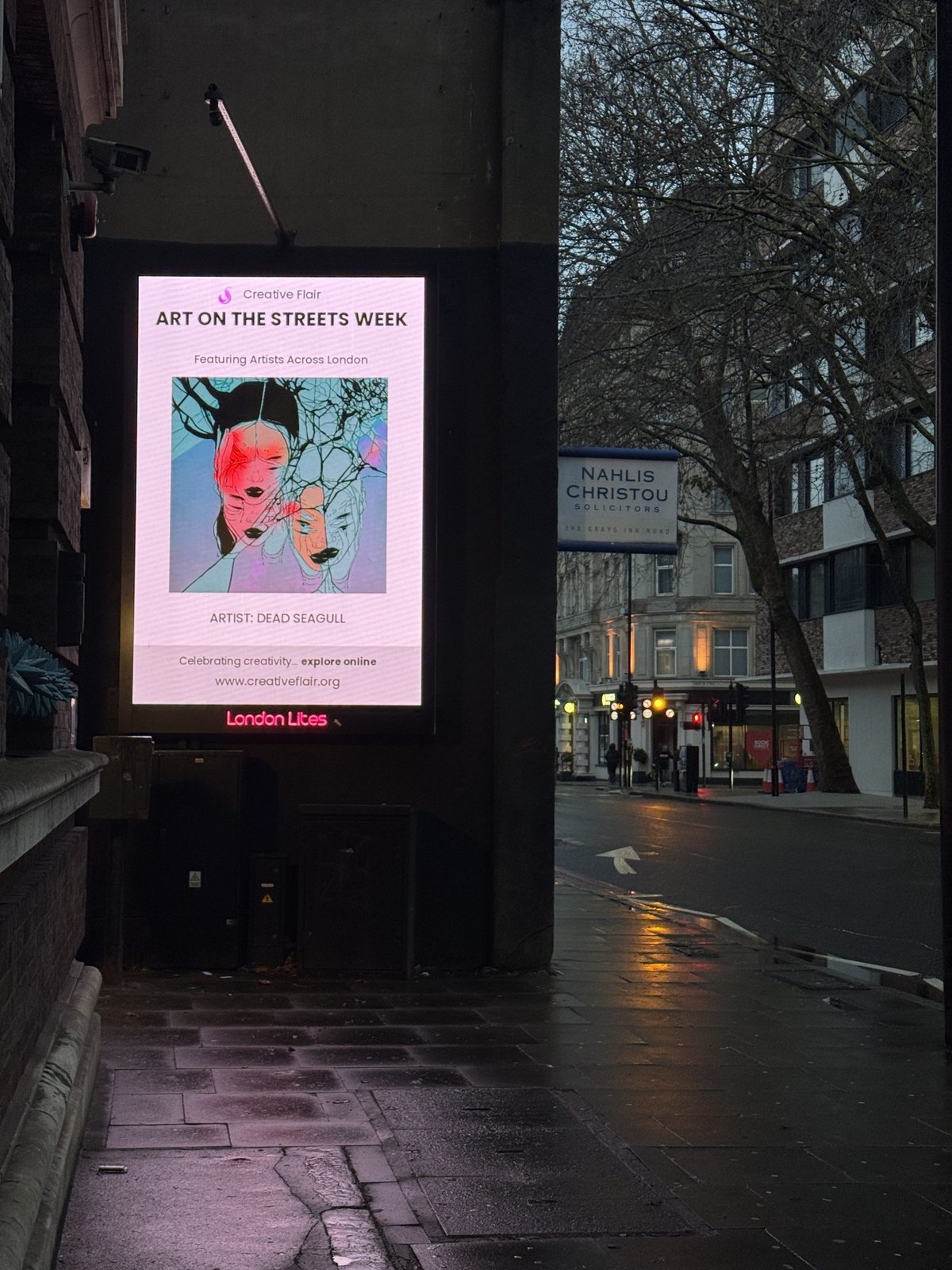 Artist work on a London billboard