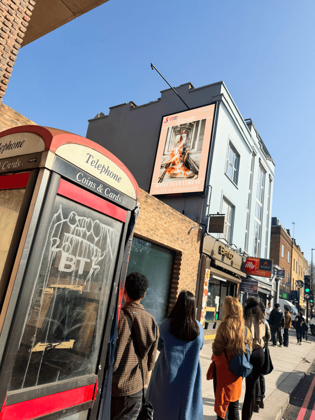 Artist work on a London billboard