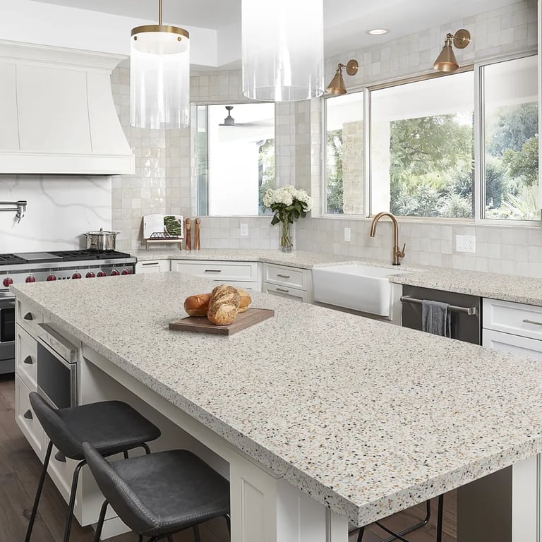 Vector agglomerate marble on countertops & Flash Ivory 5 x 5 ceramic wall tile on backsplash in kitchen.