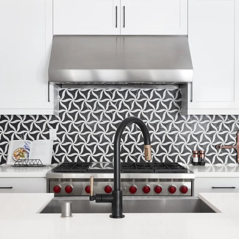 Petal Noir/Blanc Honed Marble Mesh on backsplash & Denali-N Quartz on center island and counters in kitchen.