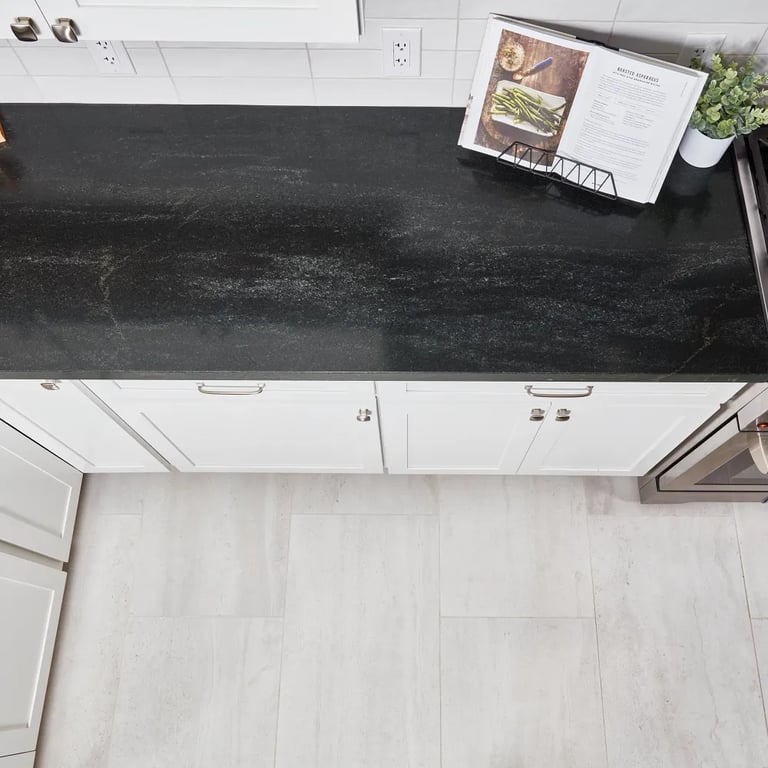 Black Mist Honed Granite (countertop), Flash White 3 x 12 (backsplash) & Tivoli Bianco 18 x 36 (floor)