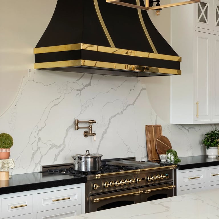 Black Mist Honed Granite on countertop and Calacatta Jubilee Quartz in kitchen
