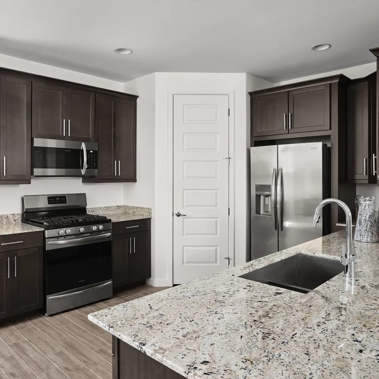White Knight granite on countertops in kitchen.