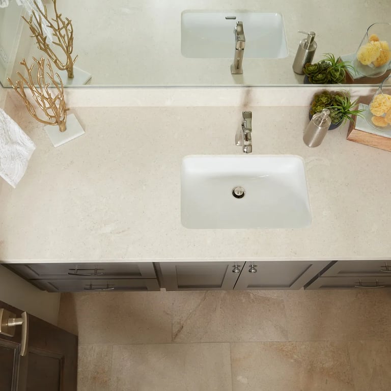 Crema Vosscione honed slab on vanity & Crema Vosscione 18 x 18 floor in bathroom.