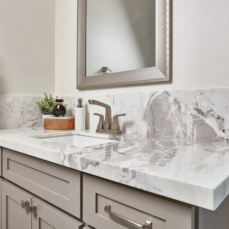 Arabescato Polished Marble (countertop) & Cala Lenci Polished 12 x 24 (floor)