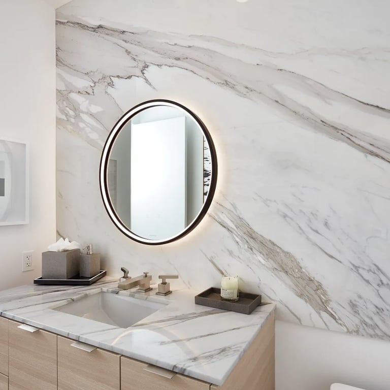 Calacatta Betogli Extra marble on feature wall and vanity in master bathroom.
