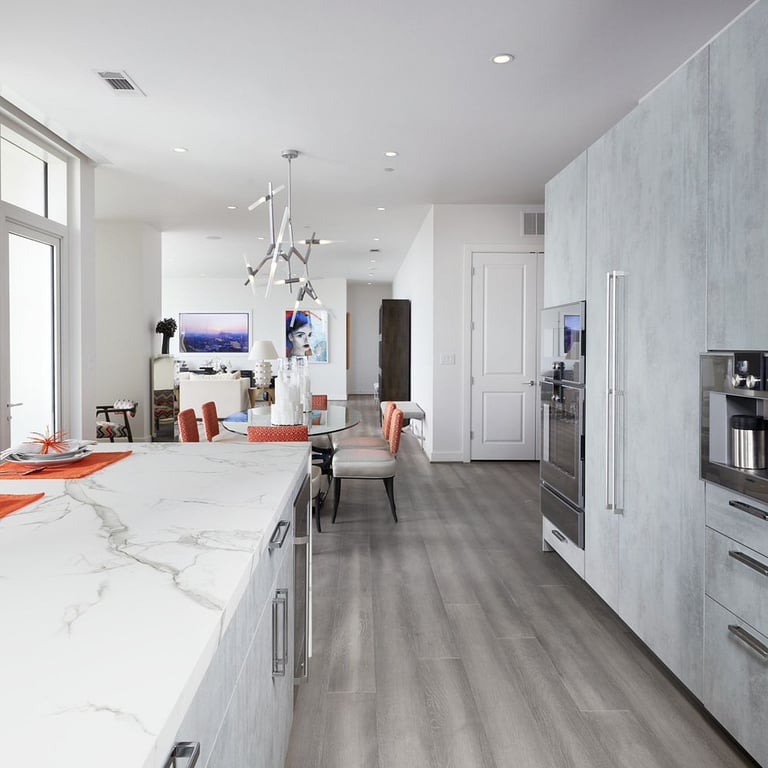 white marble kitchen with wood look floors