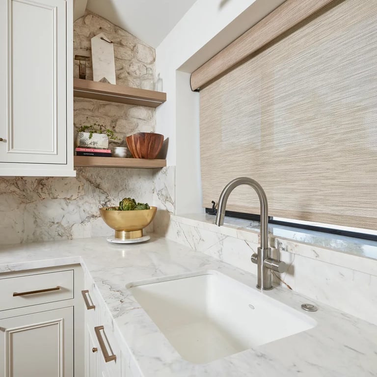 Calacatta Capixaba Marble on counters and backsplash in kitchen