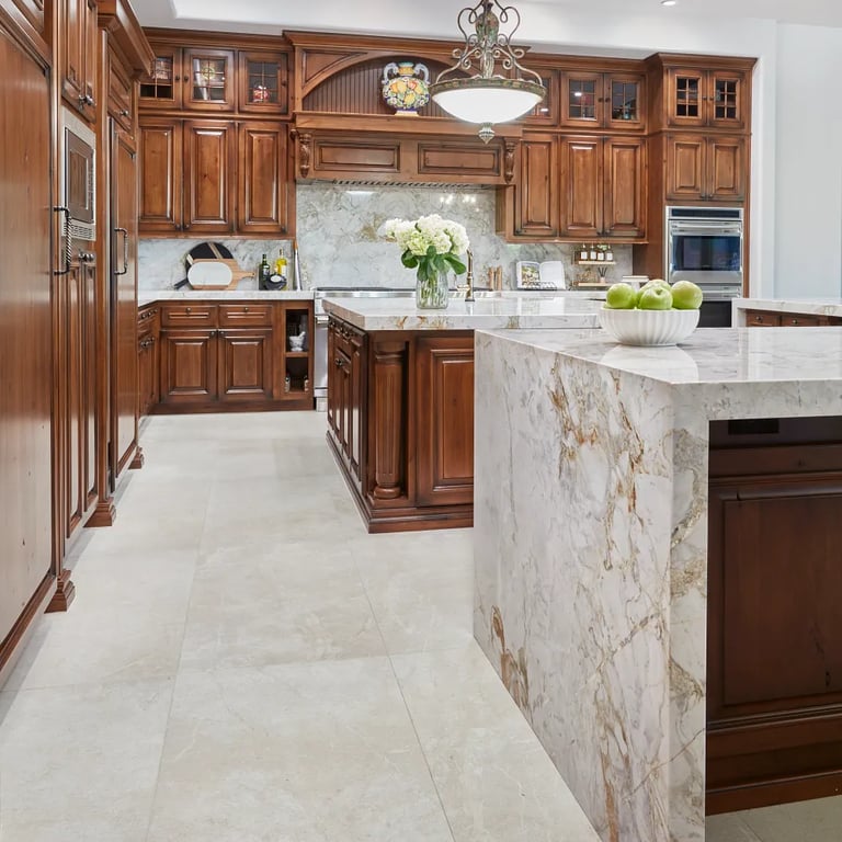 Calacatta Capixaba (island/counters/backsplash) & Anthea White 24 x 48 (floor)