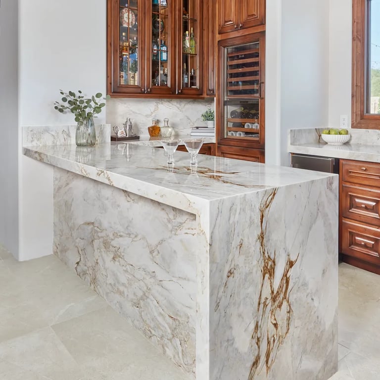 Calacatta Capixaba (island/counters/backsplash) & Anthea White 24 x 48 (floor)