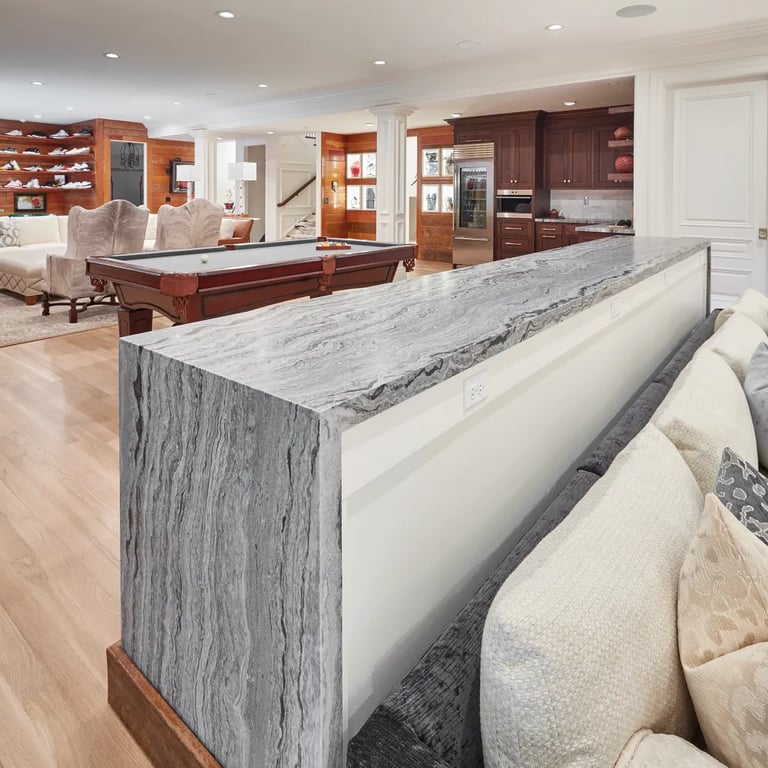 Fantasy Ocean Satin waterfall countertop in high-end recreational room.