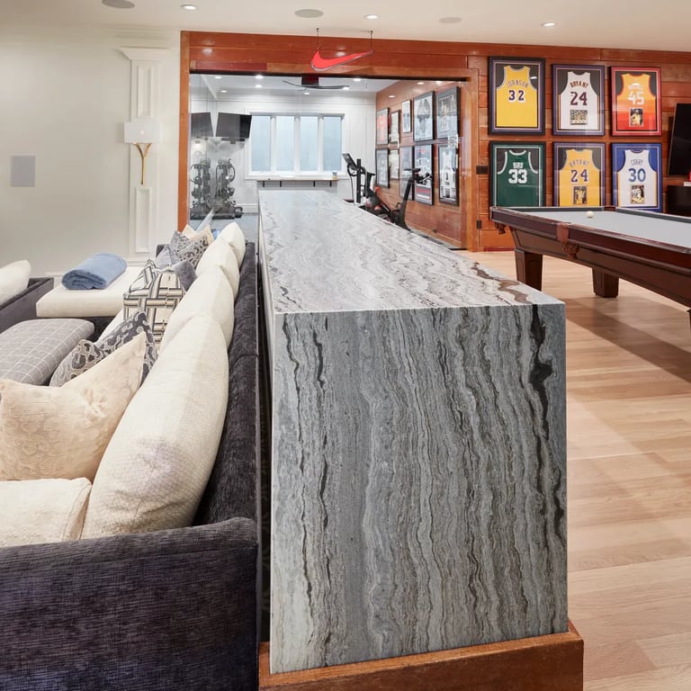 Fantasy Ocean Satin waterfall countertop in luxury game room.