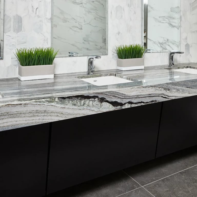 Fantasy Ocean Satin Marble vanity, CS-Calacatta Gris Honed Lotus Mesh backsplash, Tru Marmi Polished 24 x 48 Porcelain tile (right wall) & Lagos Mud 24 x 48 Porcelain tile (floor) in commercial bathroom