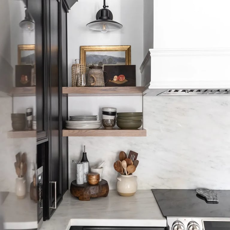 Olympian White Honed marble on counter and backsplash in kitchen.