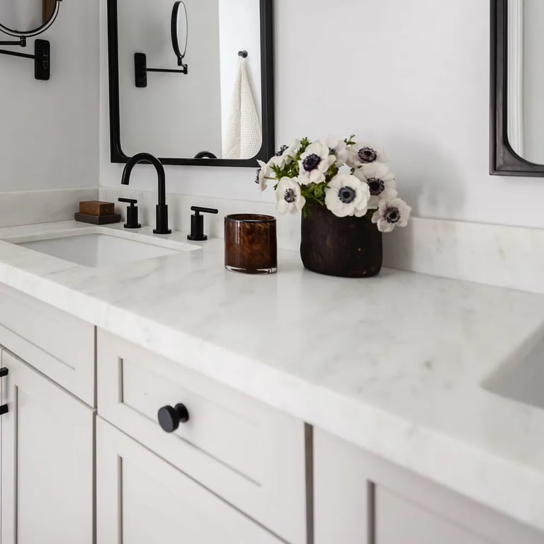 Olympian White Honed marble on vanity countertop in master bathroom.