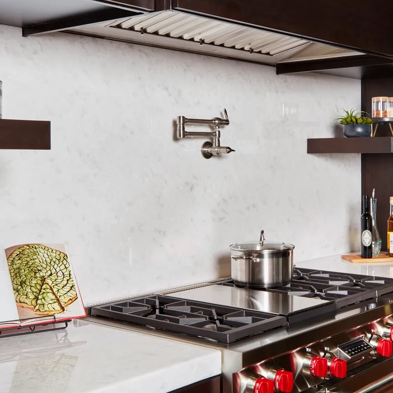 Opal White Polished marble on countertop and backsplash in kitchen.
