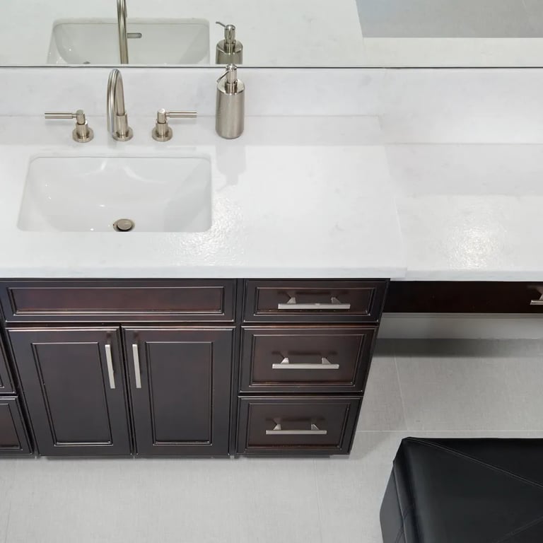 Opal White Satin marble on countertop & Touch Pearl 12 x 24 porcelain on floor in bathroom.