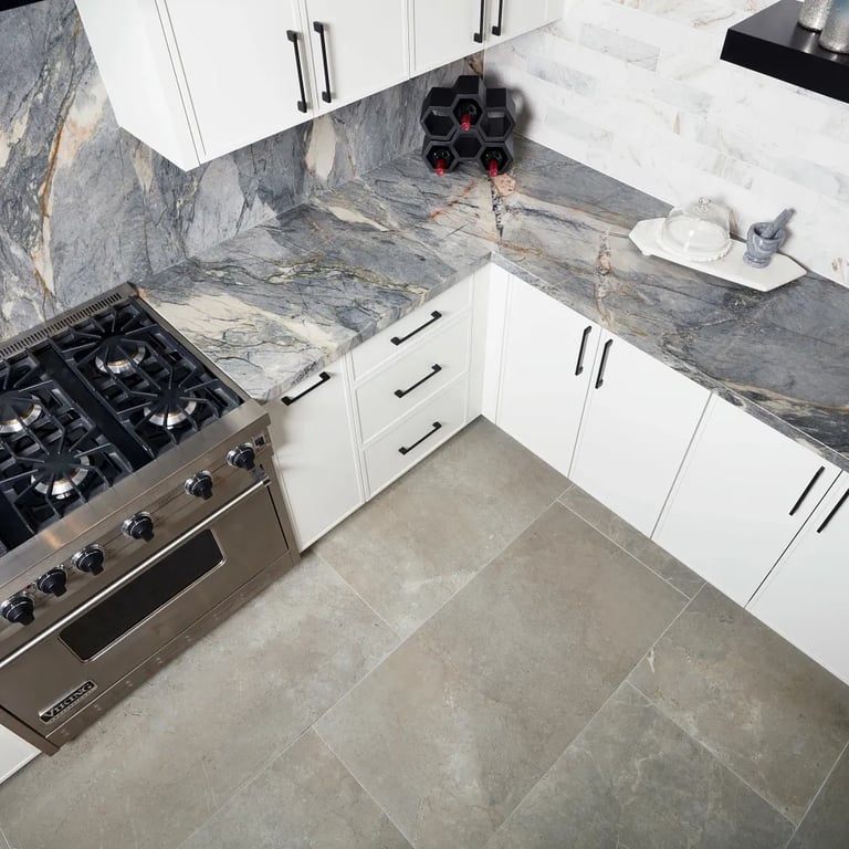 Ijen Blue Polished (counter & backsplash), Calacatta Umber Honed 3 x 12 (right wall) & Anthea Earth 24 x 48 (floor) in kitchen.