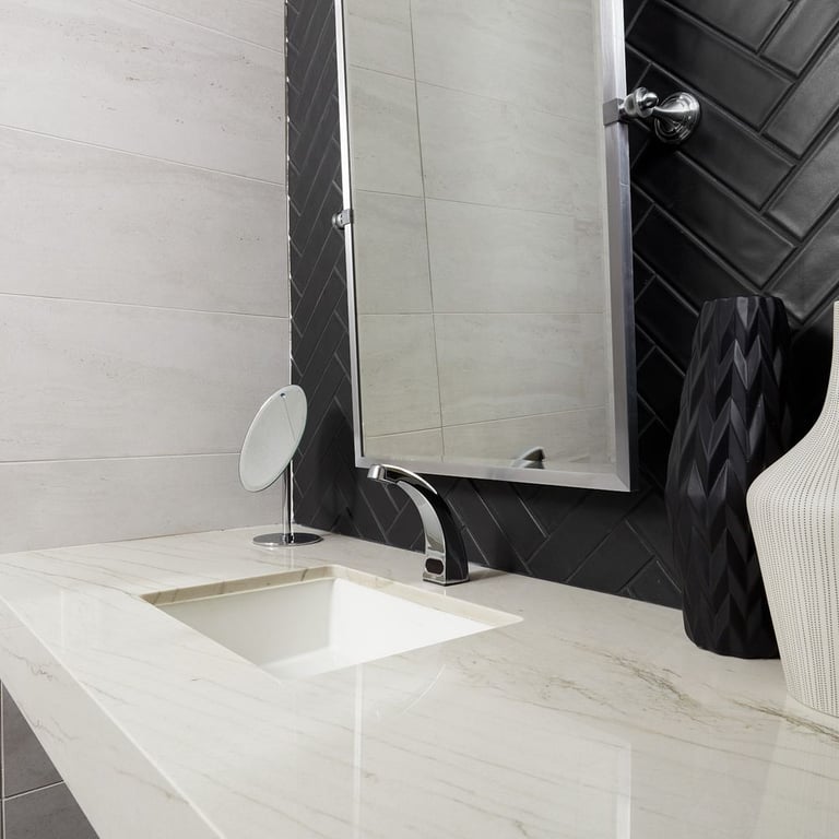 Mont Blanc Polished (counter), Concerto Black Matte 2-1/2 x 9-3/4 (backsplash) & Tivoli Bianco 12 x 24 (wall)