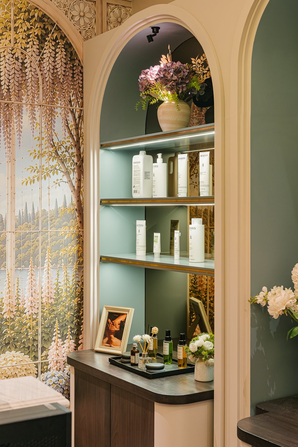 Skincare products on the arched display shelves
