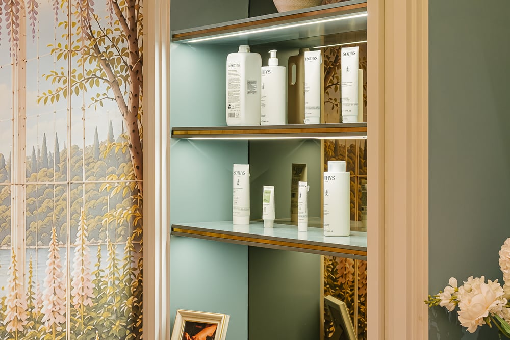 Skincare products on the arched display shelves