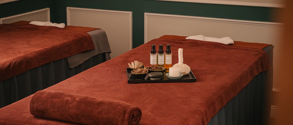 Treatment bed prepared with oils and a folded towel