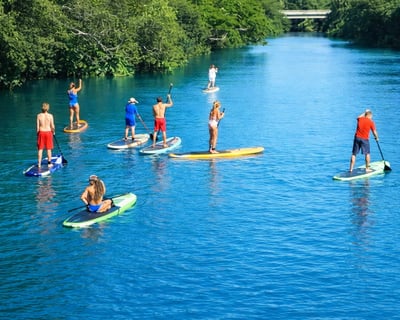 Take a North Shore Sunset Paddle Board & BBQ Tour