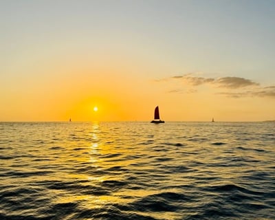 Sunset Swim & Sail Cruise in Waikiki