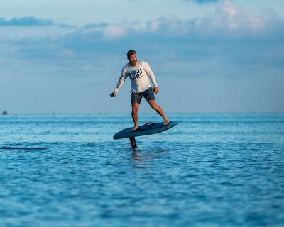 Learn to Fly Above Water on an Electric Foil