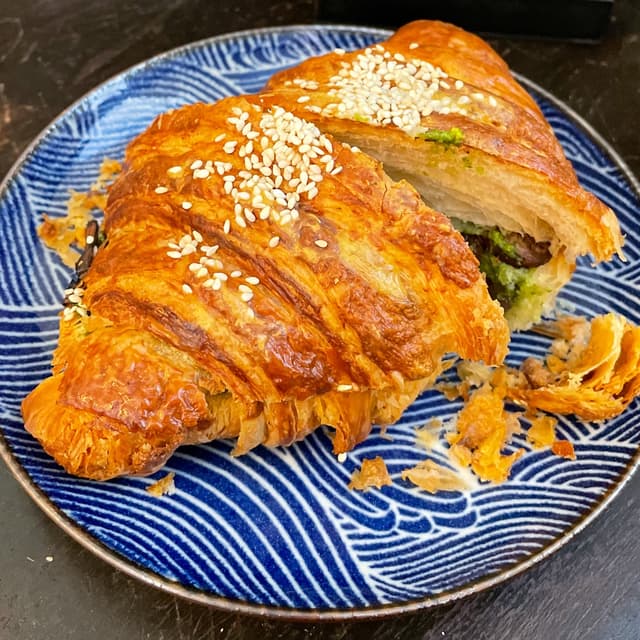 Photo of the dish “Arugula Pesto, Mushroom & Carmelized Onion Croissant”